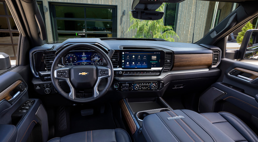 The interior of a 2024 Chevy Silverado 2500 HD High Country is shown from the driver's seat.