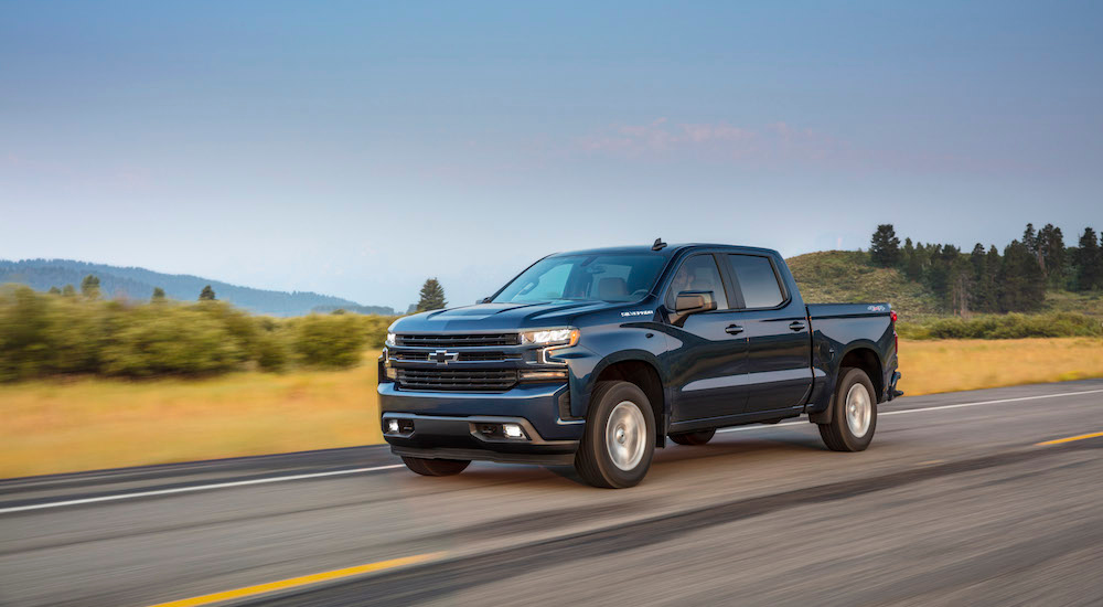 A blue 2024 Chevy Silverado 1500 RST is shown from the front at an angle.