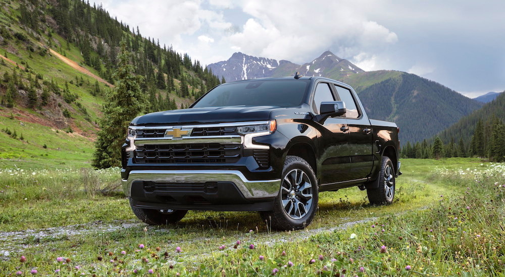 A black 2025 Chevy Silverado 1500 LT is shown from the front at an angle after leaving a Chevy dealer.