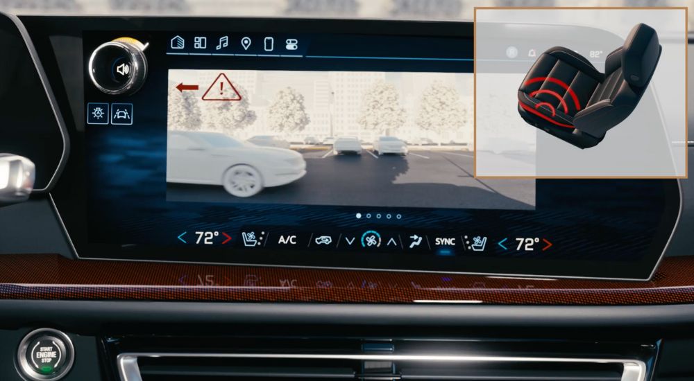 Simulated image of the rear cross traffic alert screen in a 2025 Chevy SUV.