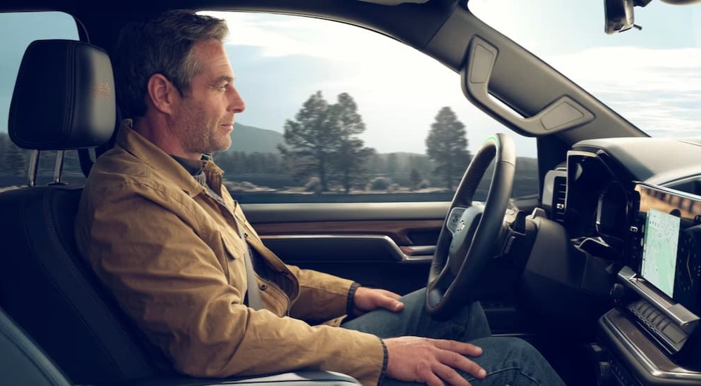 A person using Supercruise in a 2025 Chevy Silverado 1500 for sale.