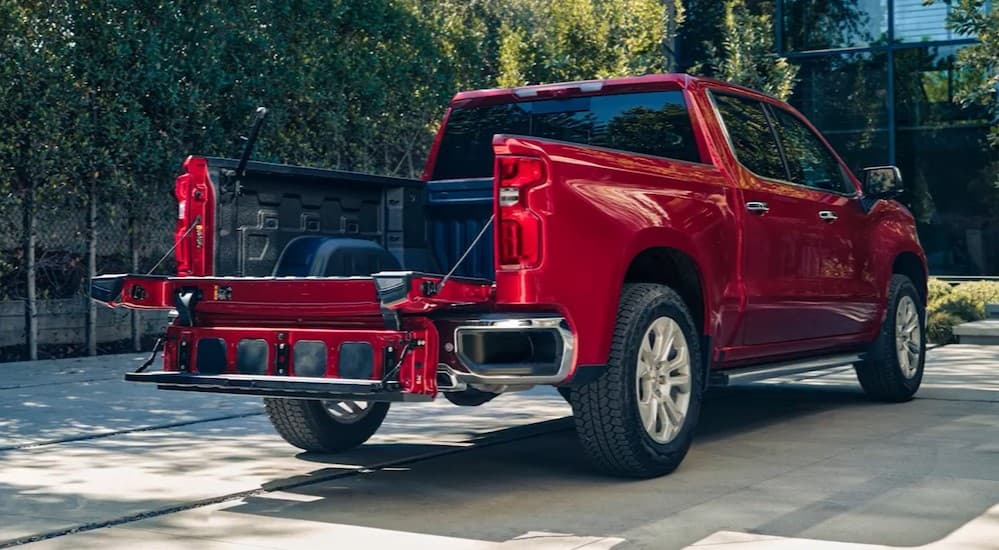 An open Multi-Flex tailgate on a red 2025 Chevy Silverado 1500 for sale.