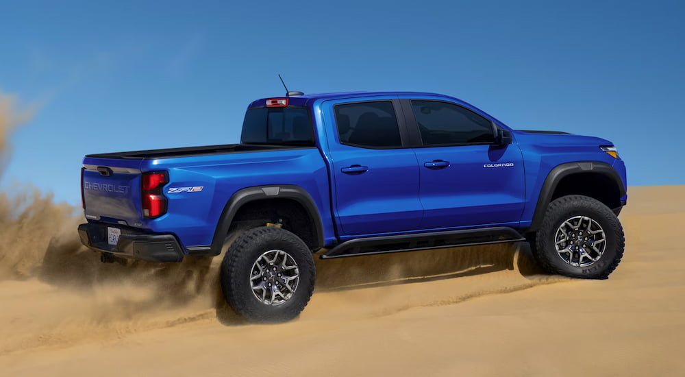 Blue 2025 Chevy Colorado ZR2 driving over sand.