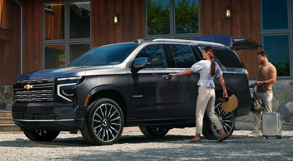 A gray 2026 Chevy Tahoe High Country parked on a driveway.