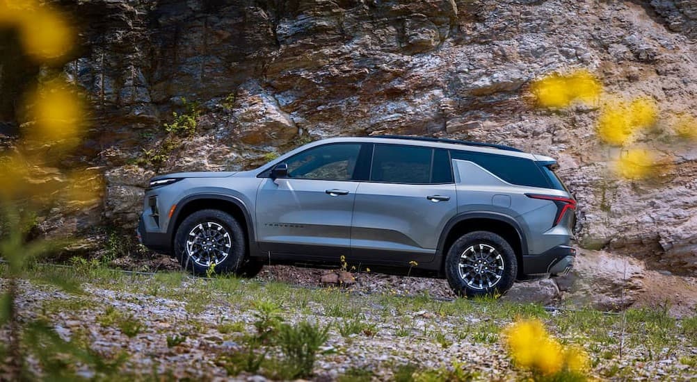 A silver 2026 Chevy Traverse off-roading.