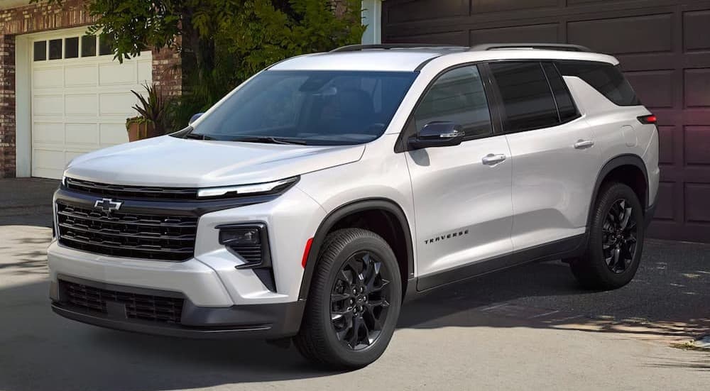 A white 2026 Chevy Traverse parked on a driveway.