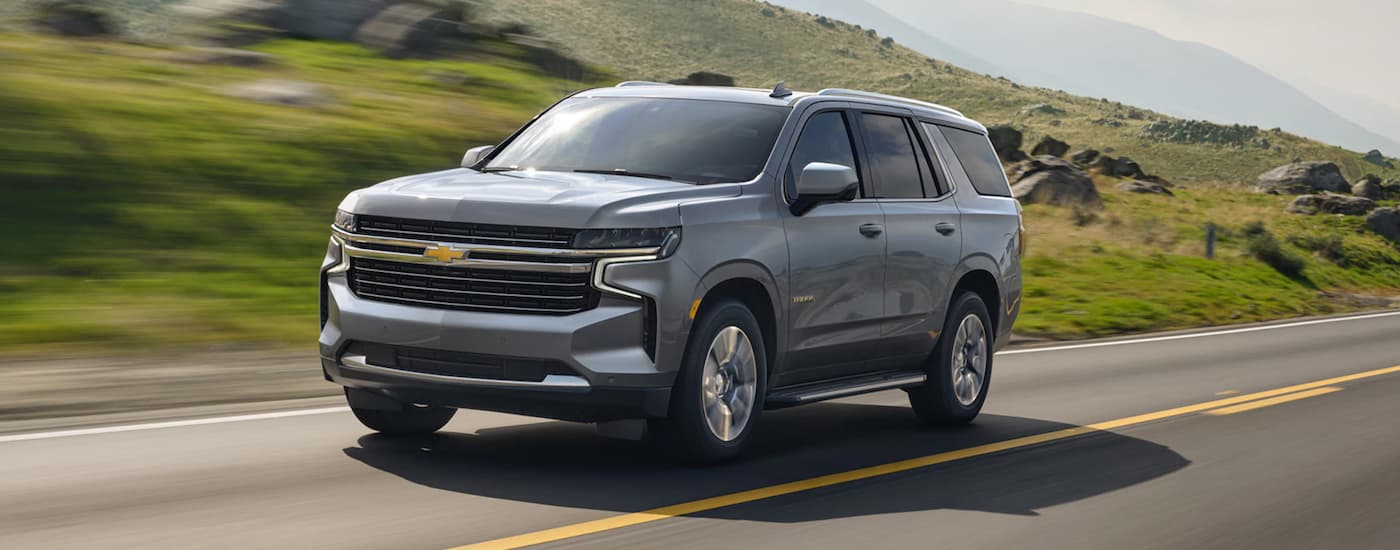 Grey 2021 Chevy Tahoe driving along an open road