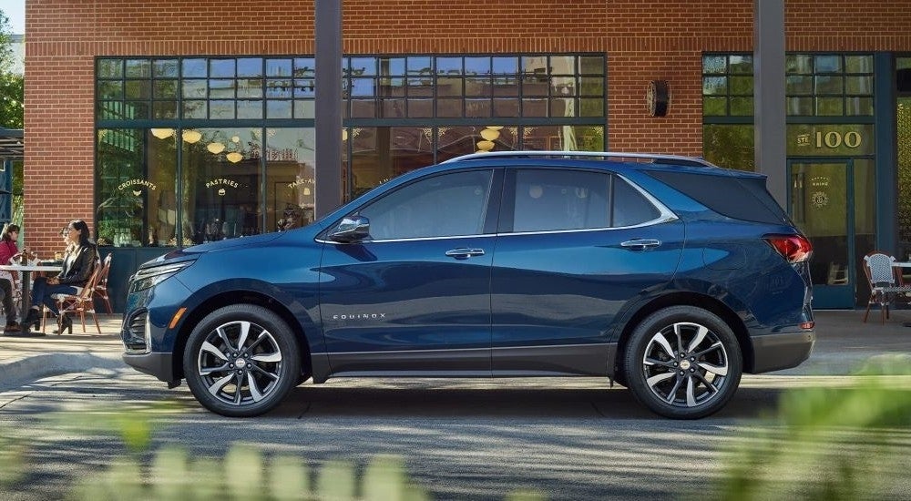 Blue 2022 Chevy Equinox parked near a brick building
