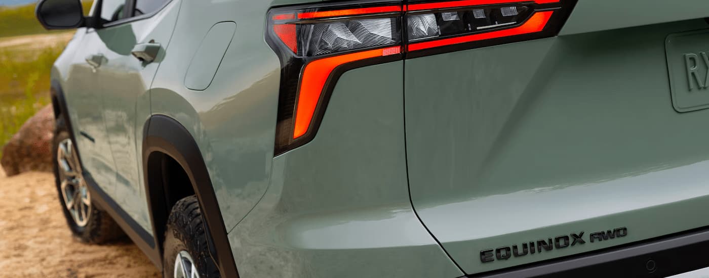 A close up of the bumper on a green 2025 Chevy Equinox ACTIV for sale.
