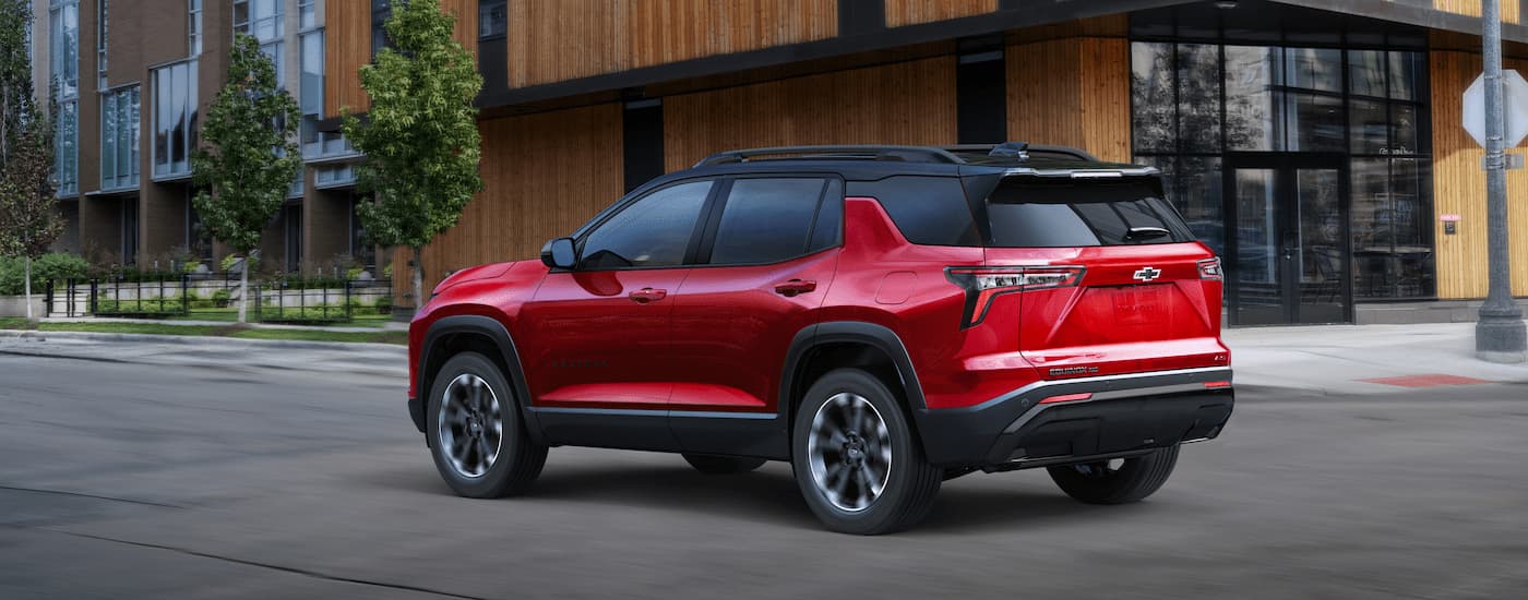 Red 2025 Chevy Equinox RS parked on the side of a street