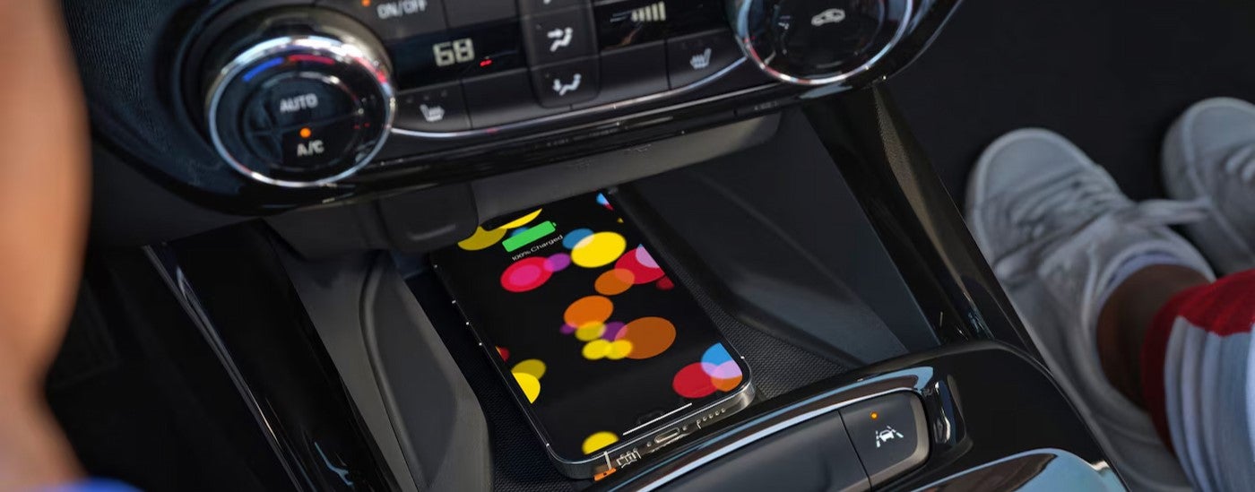 A cellphone charging in a 2026 Chevy Trax.