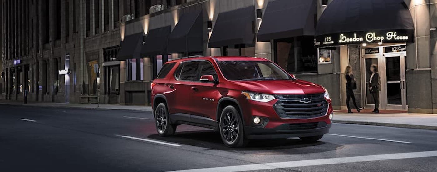 A red 2021 Chevy Traverse is shown from the front at an angle after leaving a used Chevy dealer.